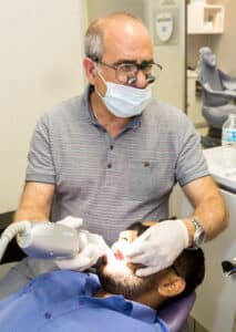 Dr. Slepchik working on a smile makeover with his patient